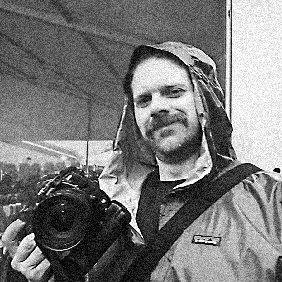 mike-capson-photographing-in-rain-at-vitos-music-fest-2021.jpg?filter=grayscale